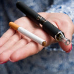 hand of woman with e-cigarette